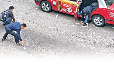 香港运钞车丢千万现金 13人交还约360万港元