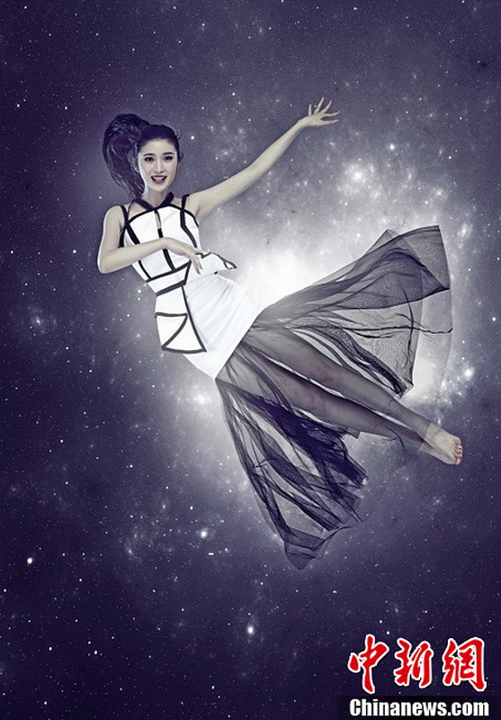 图为2013世界小姐中国区总决赛冠军直通赛佳丽——王沁云。